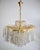 This large waterfall chandelier features a gold-plated mount and is adorned with numerous Swarovski crystals. 6 E14...