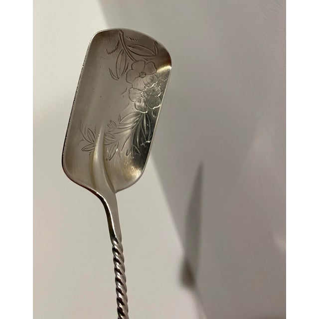 Antique 925 sterling Towle sugar shovel. Twisted handle with bright cut floral bowl. Marked on back.