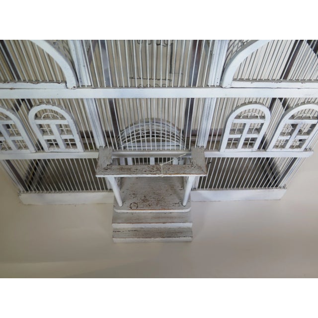 This English (Harrods Dept. Store) birdcage is a 19th Century hand constructed bird cage made from African Acacia wood and...