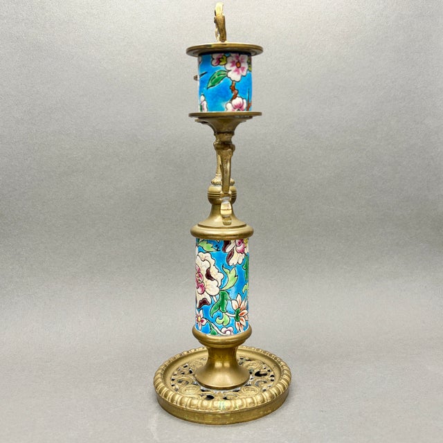 • Longwy France floral enameled faience and brass two-arm candelabra. • Made in France, circa 1920s • Turquoise blue...