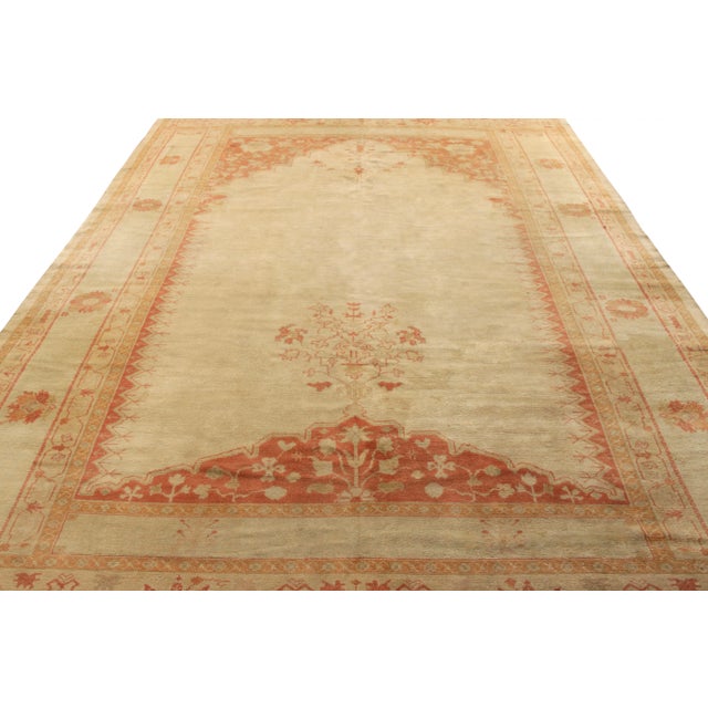 Hand-knotted in wool circa 1920-1930, this 9×12 antique Oushak rug is a rare curation from the Rug & Kilim collection....