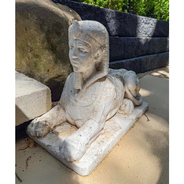 A handsome Pair of Garden statues. Modeled after the great sphinx in Egypt. Originally made in France, these garden...