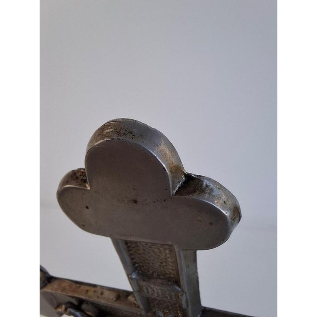 An antique table crucifix from Czechoslovakia dating to circa 1900, executed in cast iron and metal with rich Neo-Gothic...