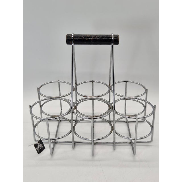 An original six-bottle bottle rack from the german brand zack, known for its modern home decor accessories and distinctive...