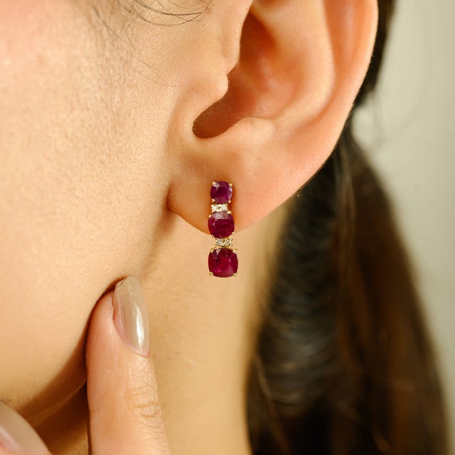 Elevate your elegance with these captivating drop earrings, beautifully crafted in 14k yellow gold. Showcasing a total of...