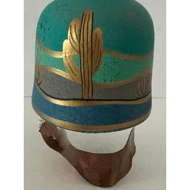 Vintage ceramic pottery bell with hand painted southwestern scenery. Copper piece clacker.