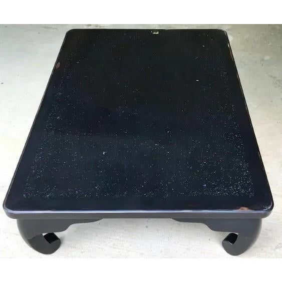 A striking Chinese black lacquer low table in the Ming style, dating to the 1940s, with an exceptional and deeply personal...