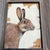 Approximately 5.5 x 7.5 painting on Masonite signed bottom right Overall size with distressed wood frame is 9 x 11