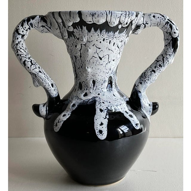 A good quality French Fat Lava style handled vase. This stunning design and glazed finished piece will enhance any shelf...