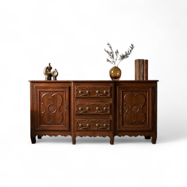 The authentic elegance of a French country house. Superb vintage sideboard with classic lines and carved details. The...