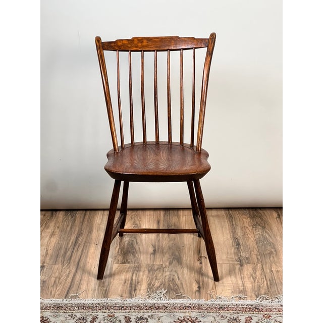 This wonderful antique step down Windsor chair dates to the early 19th century and is a classic example of the simple,...