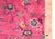 A striking 1930s Chinese Art Deco rug featuring a vibrant magenta field adorned with an asymmetrical composition of...
