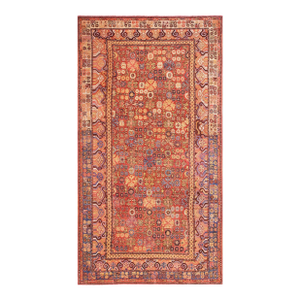 An Artistic Mixing Flower Sprays on a Red-Raspberry Background Color in a Khotan Style Antique Central Asian Chinese Rug