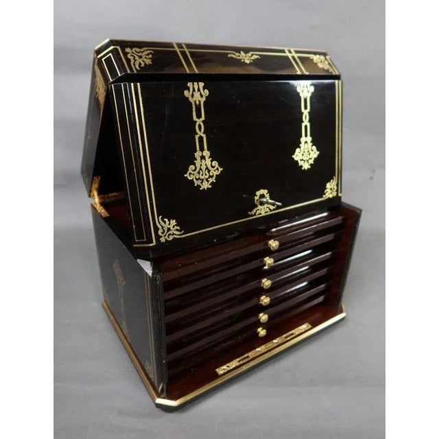 "Cigar cabinet XIX" Cigar cabinet in ebony inlaid with brass stamped by the Giroux house in Paris. Dimensions: 31cm x 23cm...