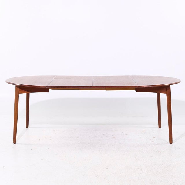 Peter Hvidt Style Mid Century Danish Teak Expanding Dining Table with 2 Leaves This table measures: 47 wide x 47 deep x...
