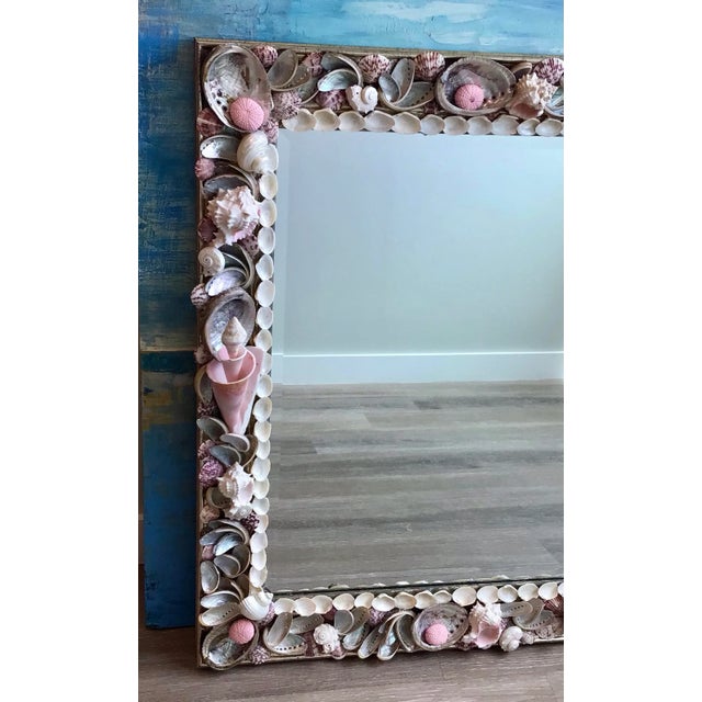 Generous square Mirror with beveled glass and the most Exotic natural sea shells. Sweet Pink and silver grey will...