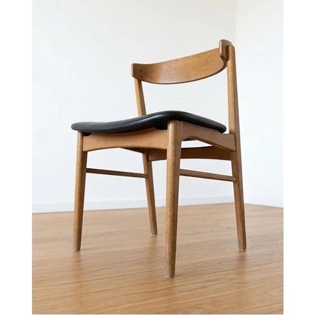 Set of four vintage Danish teak dining chairs from the 1950s. Dimensions (per chair): Width: 50 cm Depth: 52 cm Height: 73...