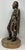 Spanish Colonial figure of a soldier in a long, vertical-grooved cloak or mantle, which is a common feature in antique...