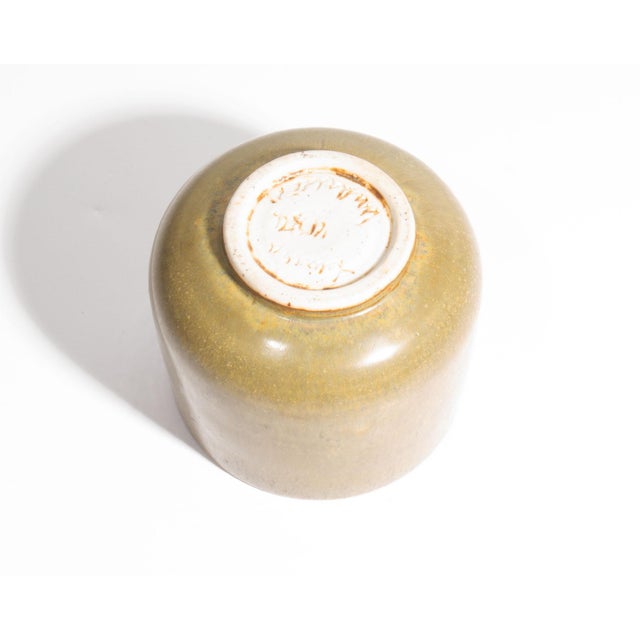 A 1954 studio pottery cup by the American ceramic artist Laura Andreson (1902-1999). This diminutive cup features an...