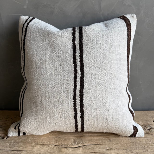 Creamy white hemp rug pillow with stripes. Soft hand, linen blend backing with zipper closure. Spot cleaning is...
