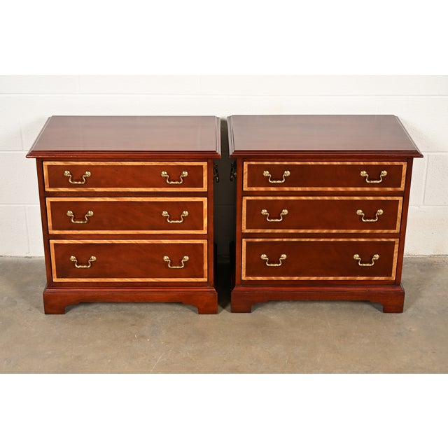 A beautiful pair of Georgian or Chippendale style nightstands or bachelor chests of drawers By Baker Furniture USA, Circa...