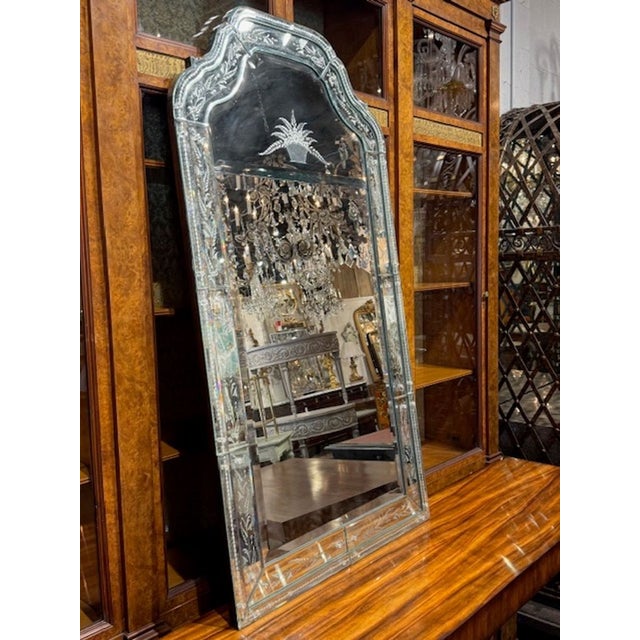 This early 20th century Venetian glass mirror exudes craftsmanship and elegance, making it a standout piece for home...