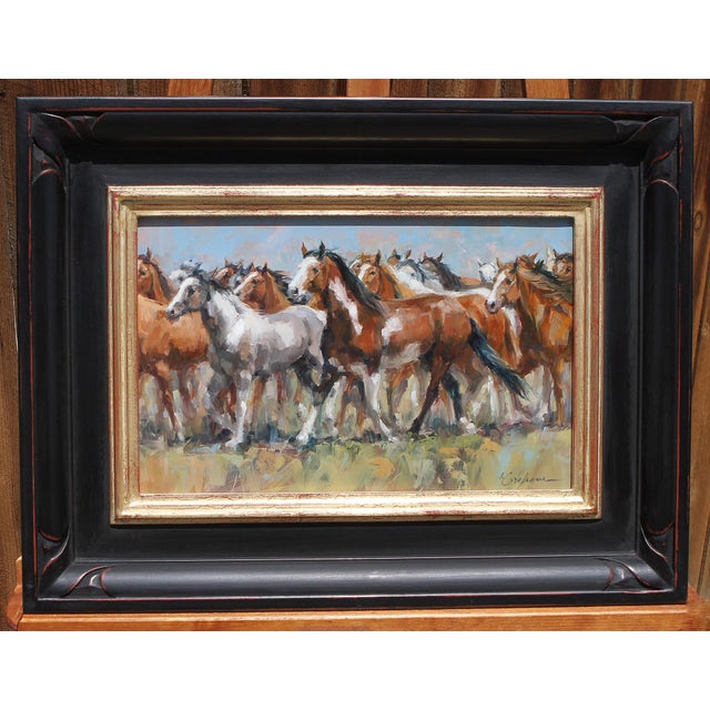 This artwork depicts a dynamic scene of a herd of horses in motion, capturing the energy and unity of the stampede. The...