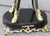 Featured are an elaborate pair of black enameled goat feet pedestals from the late 19th century. The feet are gilded...