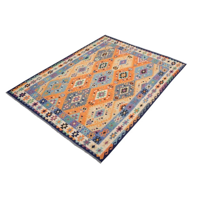 Add a touch of elegance to your home with this casual chic hand woven Tribal Kilim wool rug. Constructed on a loom by...