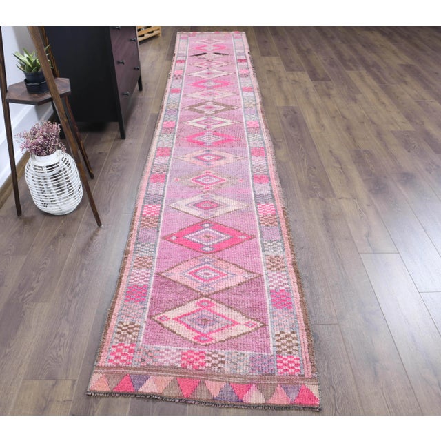 Vintage Turkish Hand-Knotted Runner Rug is a semi-Vintage runner rug. '70s Eastern region of Turkey's unique rug is...