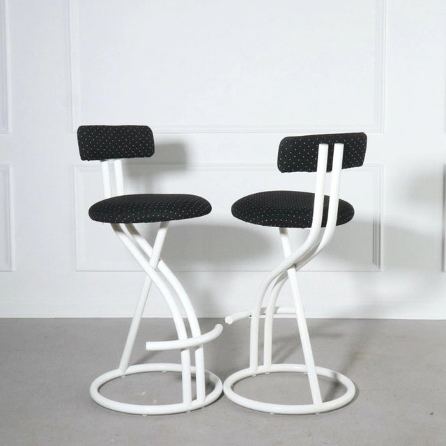 Sculptural set of post modern tubular steel bar stools in a contemporary black and white upholstery. By Cal-Style....