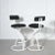 Sculptural set of post modern tubular steel bar stools in a contemporary black and white upholstery. By Cal-Style....