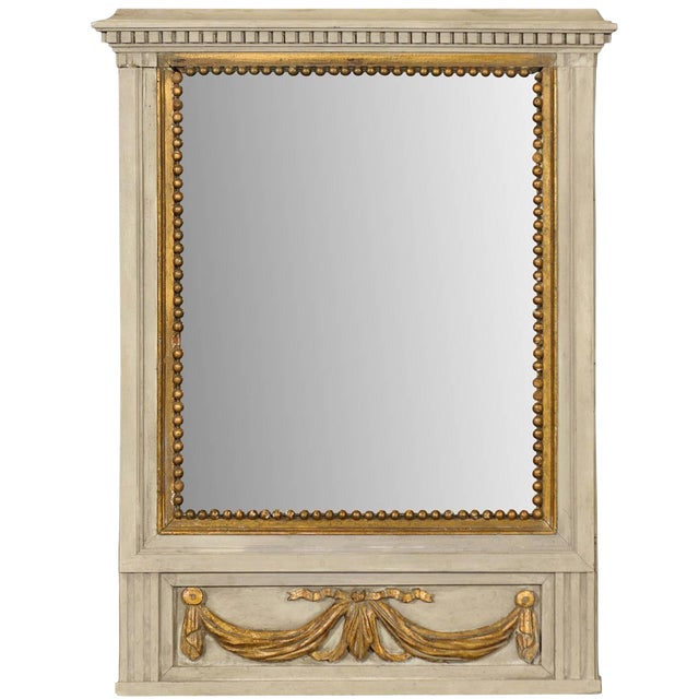 French Mirror in Small Size With Antiqued Glass and Gold Swag Motif on Beige For Sale