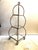 Add a touch of vintage glamour to your space with this stunning Hollywood Regency three-tier étagère. Crafted circa the...