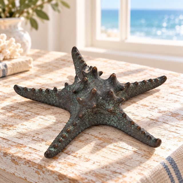 A distinctive Maitland-Smith starfish sculpture with dimensional texture and a richly mottled finish. Five tapering arms...