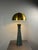 Rare mosaic and brass inlaid double light fixture which can be used a as large table lamp or low floor lamp. The lamp has...