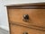 A small early 20th century Georgian style oak chest of drawers with a simple clean design and bevelled top and corners....