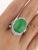 14.68 Carat No Heat Type A Jadeite Jade Ring with Diamond Curved Split Shank in 18K Gold. This exceptional piece boasts a...