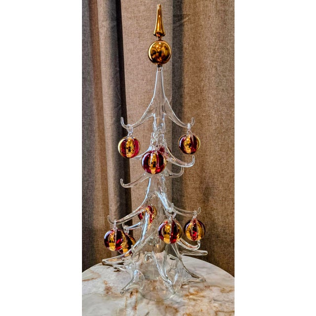 A dramatic and highly decorative 20-inch hand-blown Italian art-glass Christmas tree by Soffieria Parise Vetro, complete...