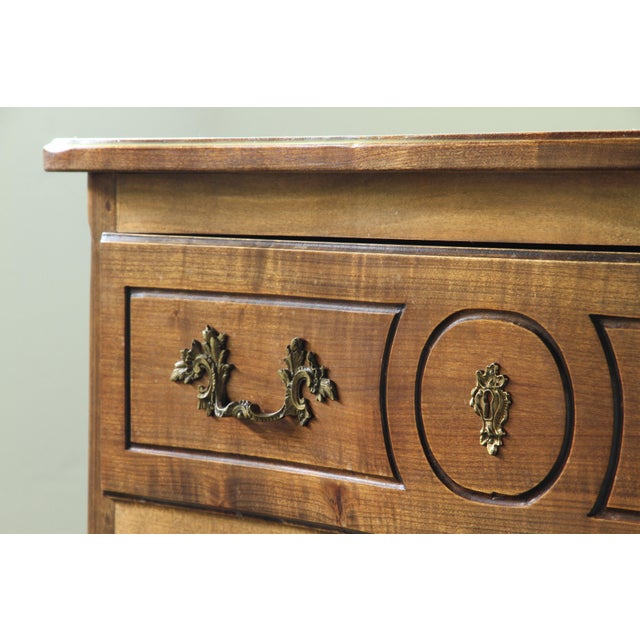 A testament to the refined rustic elegance of the south of france, this exquisite mid 18th-century commode embodies the...