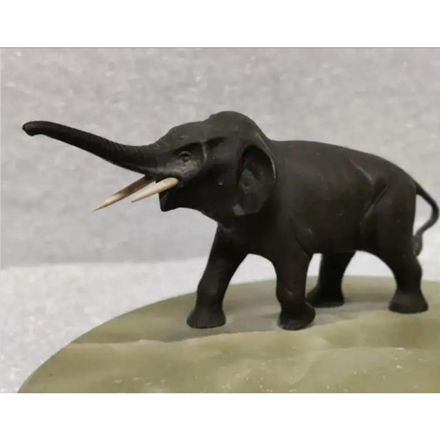 For Your Consideration. . . A rare miniature bronze elephant mounted on green onyx marble. This charming little elephant...