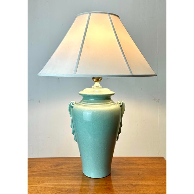 A beautiful crackle glaze celedon green ceramic lamp circa mid 20th century. Perfect color with glossy finish. 3-way...