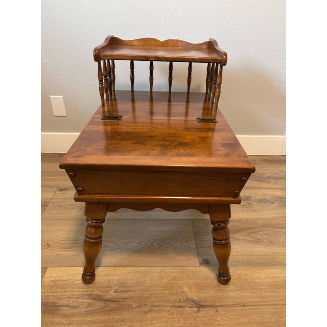 A charming vintage step-end table in the Early American / Colonial Revival tradition. Solid wood with a rich, warm walnut-...