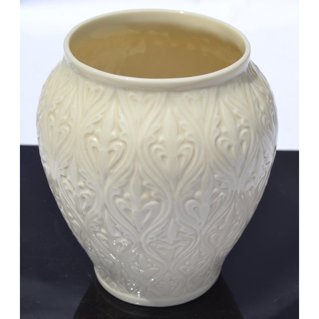 The Kismet Collection Lenox embossed Fleur-de-lis pattern ginger jar vase is a collectible porcelain piece, featuring...