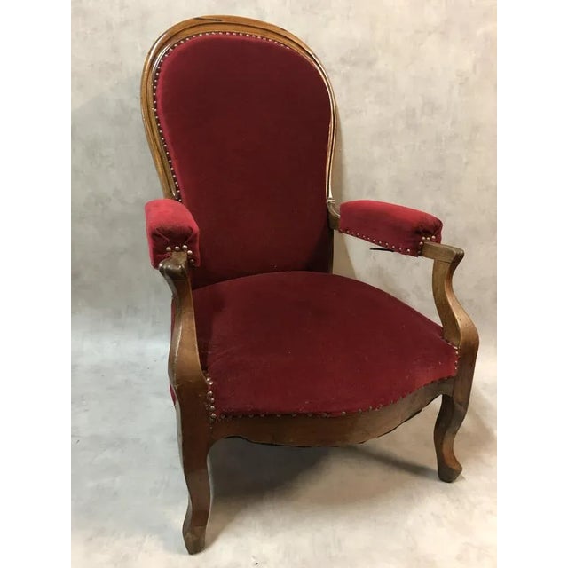 Voltaire armchair in walnut with rack and pinion, red felt, the ''voltaire'' armchair is characteristic of the ''Louis-...