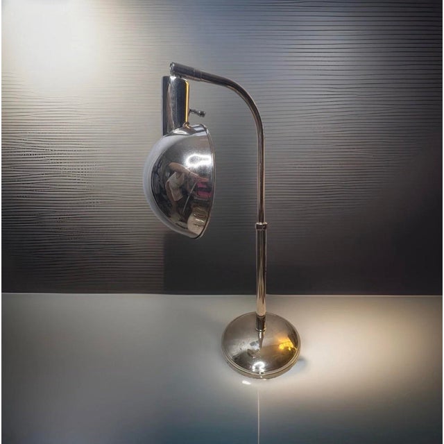 Authentic Tensor mid-century modern silver task lamp in polished chrome with a fully adjustable arm and directional shade....