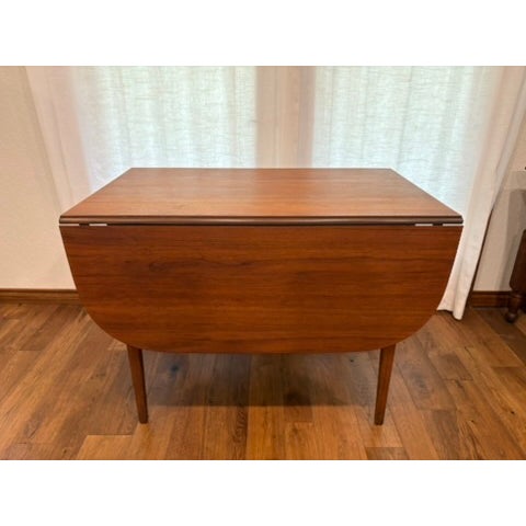 1960s Danish Modern Teak Drop-Leaf Dining Table Style & construction: Danish modern teak drop-leaf Label: Retail/import...