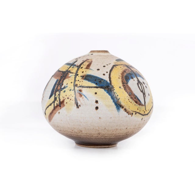 Clyde Burt ceramic vase in glazed stoneware with abstract multicolored glaze. Signed to underside: [CB]. American, circa...