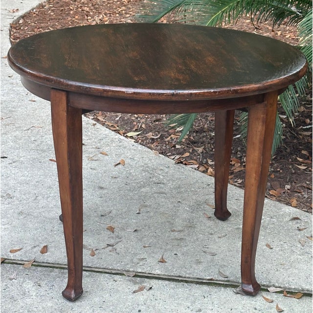 Handsome 40" round George III table with dark English oak finish. This versatile table would work as well in a center hall...