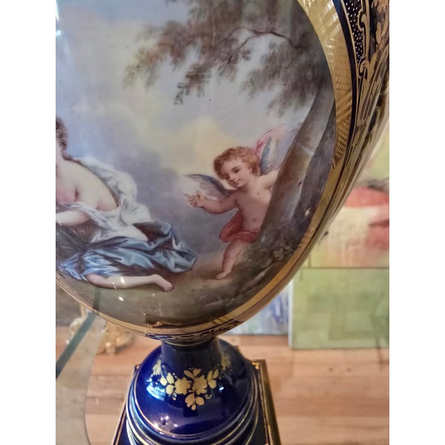 A true antique original pair of museum quality urns attributed to sevres ( guaranteed handpainted handmade over 150 years...